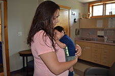 Photo of mom and baby in clinic room at Six Nations birth centre.