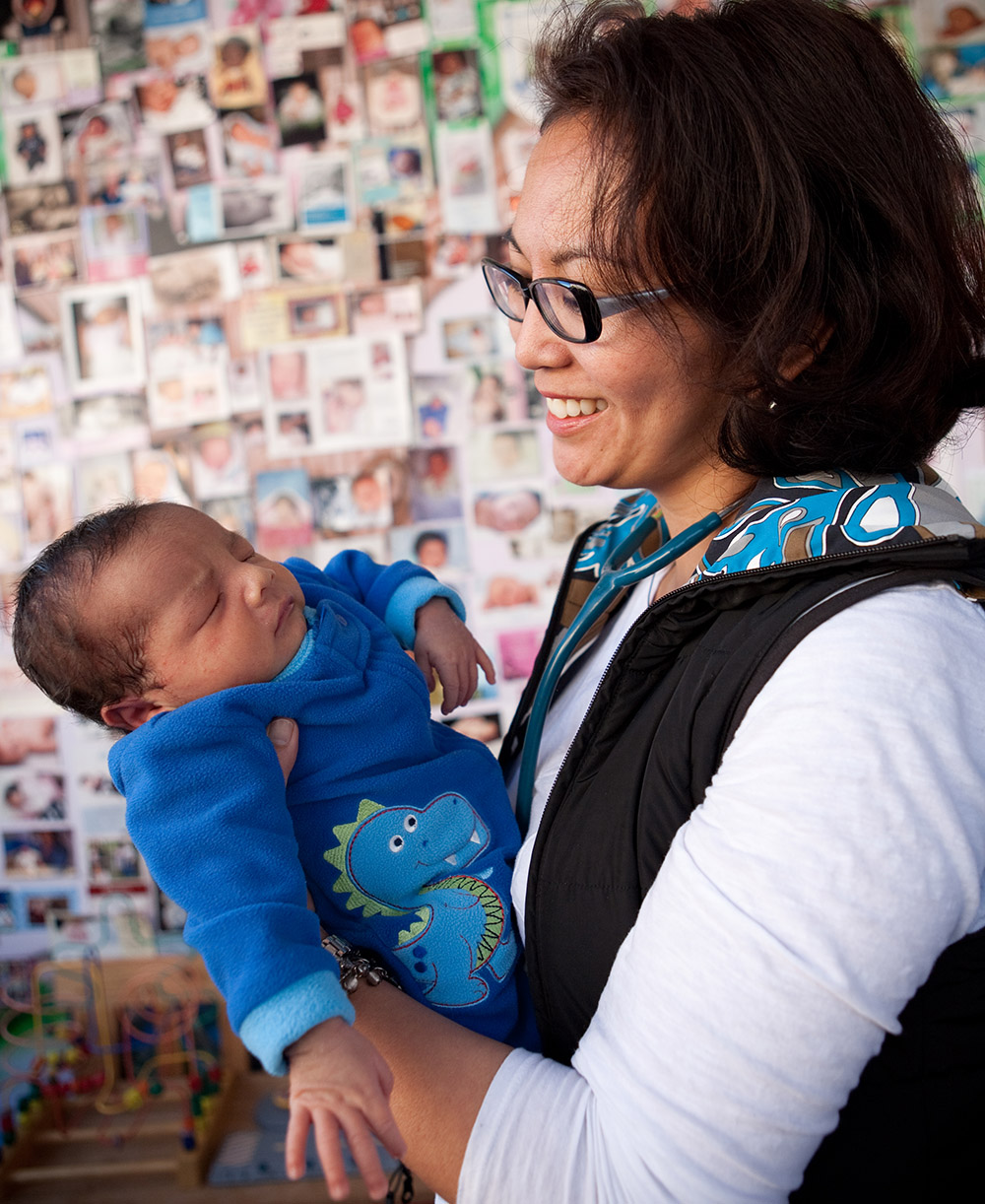 Woman holding newborn baby