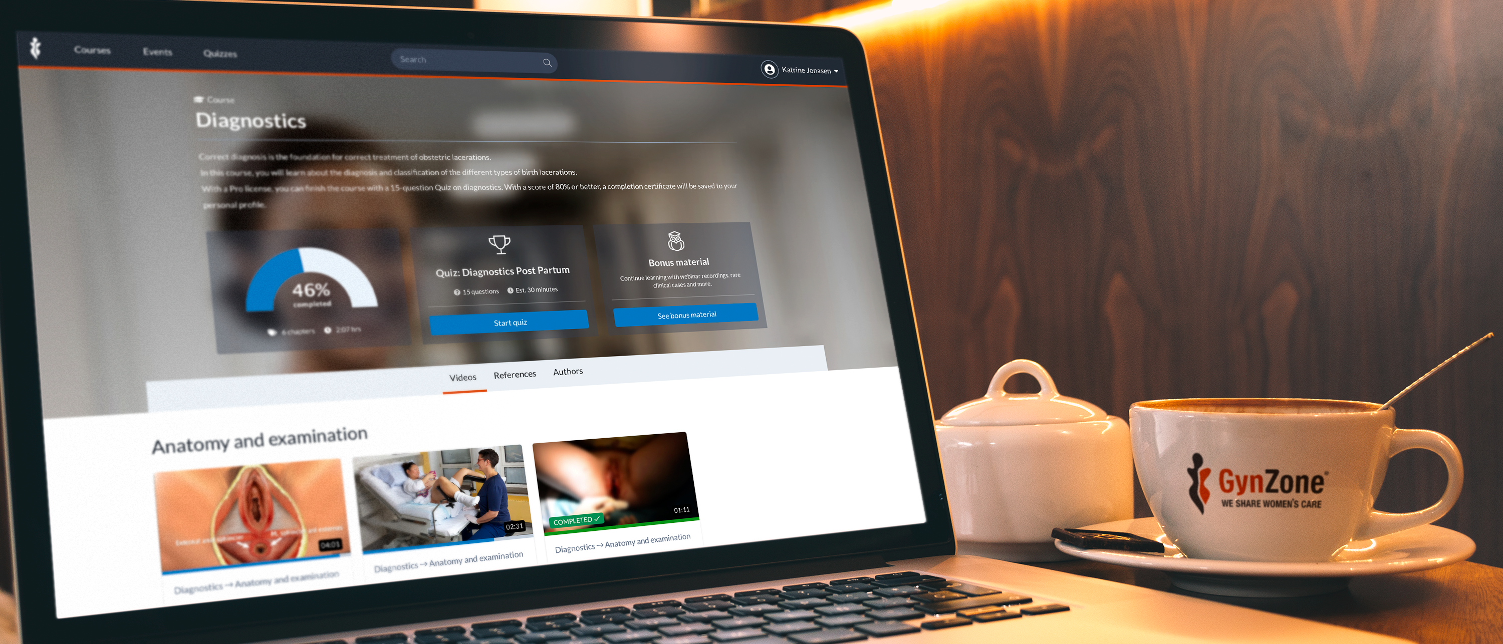 The gynzone website is displayed on a laptop
