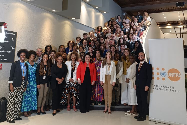 Participants of the symposium gathered on a staircase.
