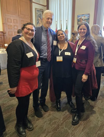 A-O-M staff with MPP Chris Glover and midwife Manavi Handa.